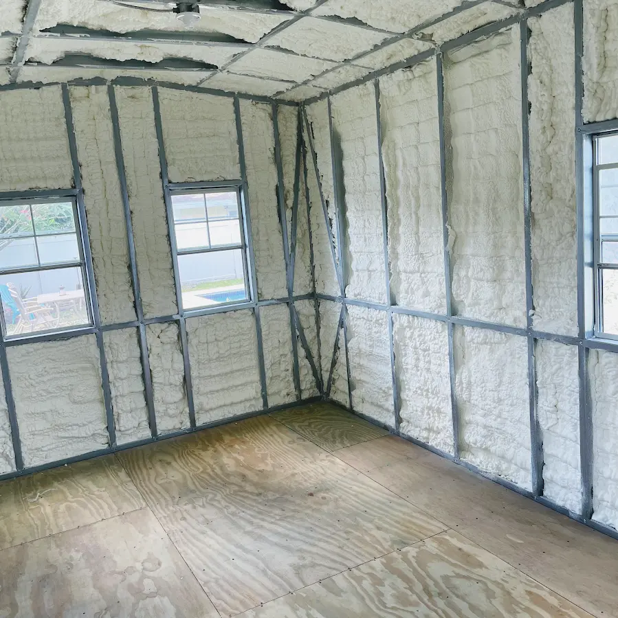 Closed-cell spray foam insulation applied to wall cavities in a residential project in Corry